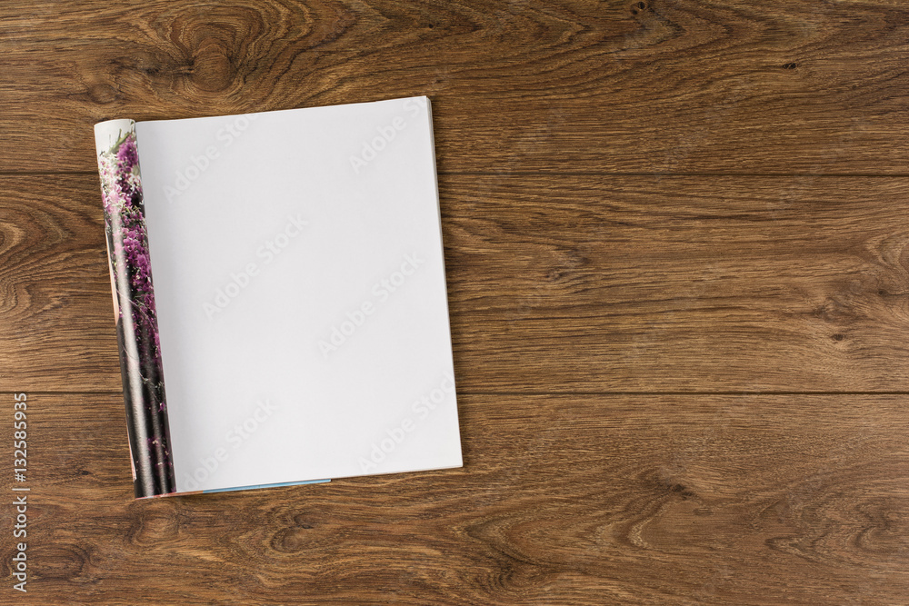 Mock-up magazine or catalog on wooden table. Blank page or notepad on wood background. Blank page or notepad for mockups or simulations. Mock-up magazine or catalog on wooden table. Blank page or notepad on wood background. Blank page or notepad for mockups or simulations.