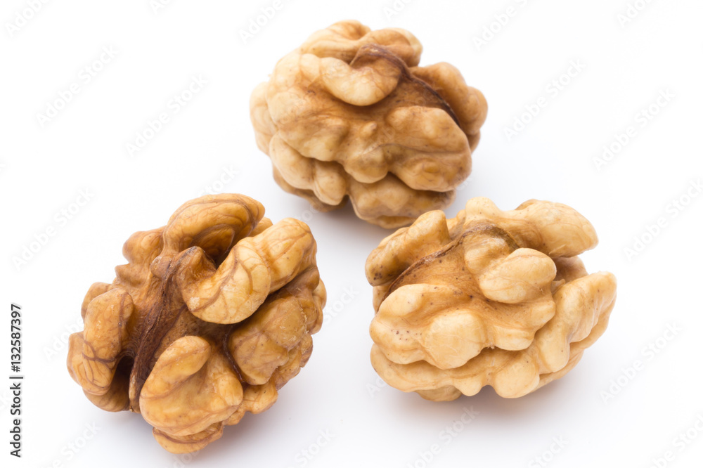 Walnut and walnut kernel isolated on the white background. Walnut and walnut kernel isolated on the white background.