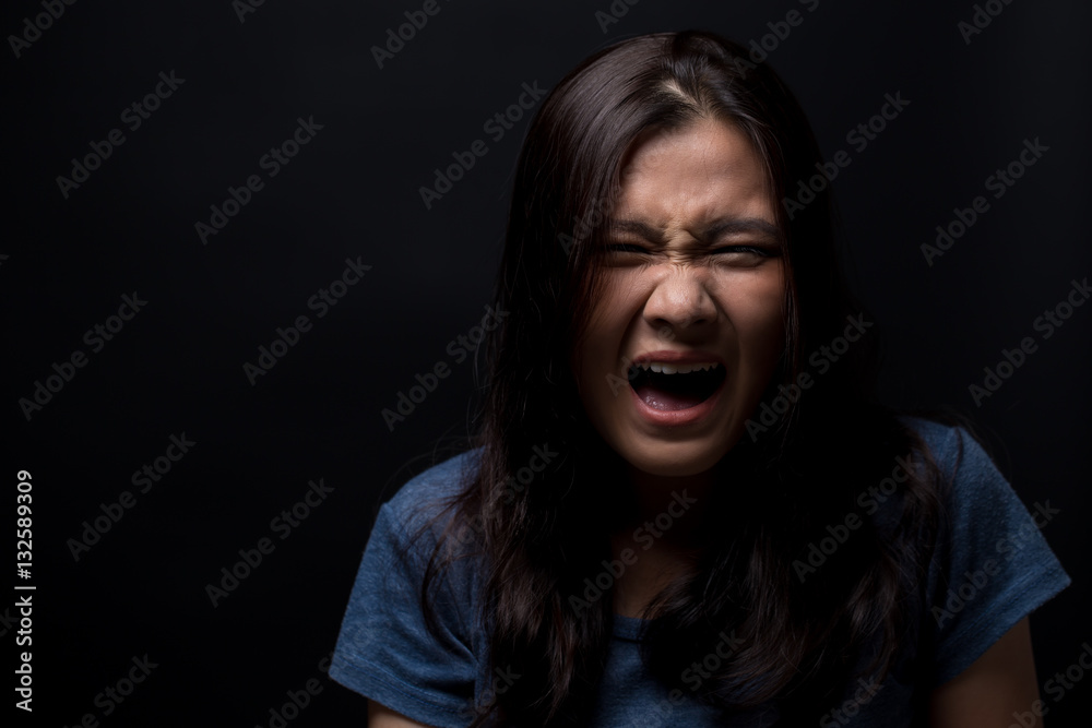 Screaming woman on black background Screaming woman on black background