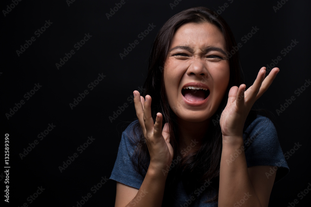 Screaming woman on black background Screaming woman on black background