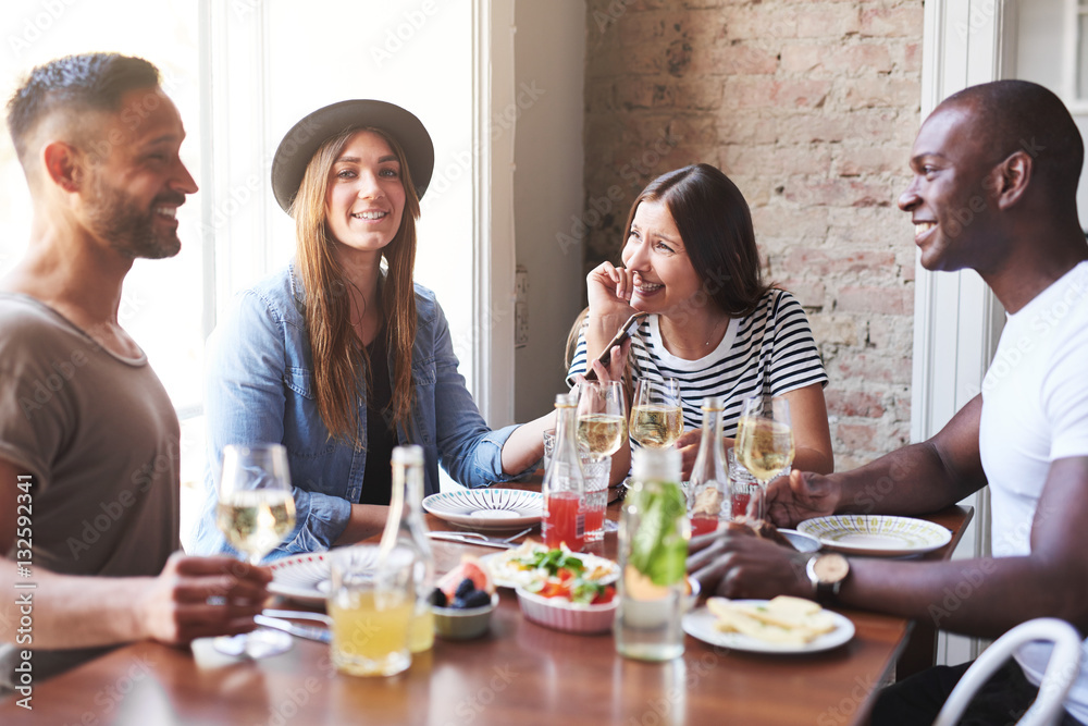 Group of young people dining at restaurant