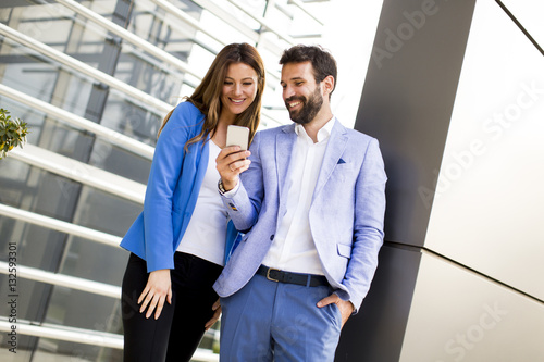 Young couple with mobile ph...