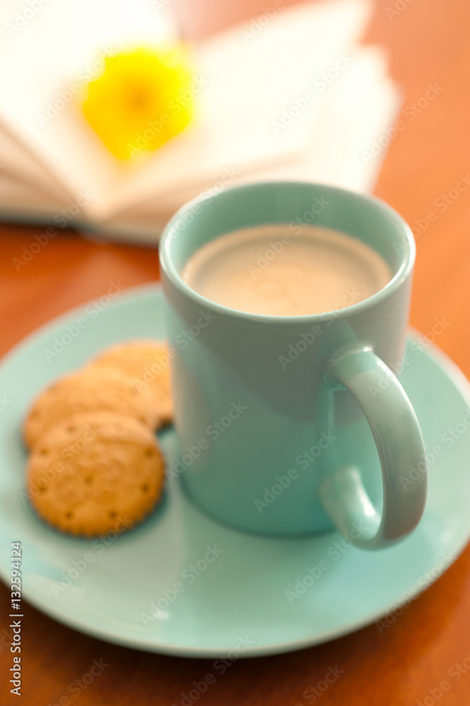 aqumarine mug of coffee with biscuits and book aqumarine mug of coffee with biscuits and book