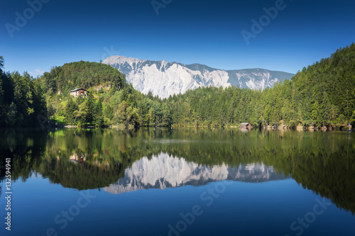 Obraz na płótnie Landscape protection area Achstürze. Lake Piburger See and alps in the background. Tirol oldest nature preserves. Oetz alps, unique cultural mountains landscape. Ötztal valley. w salonie