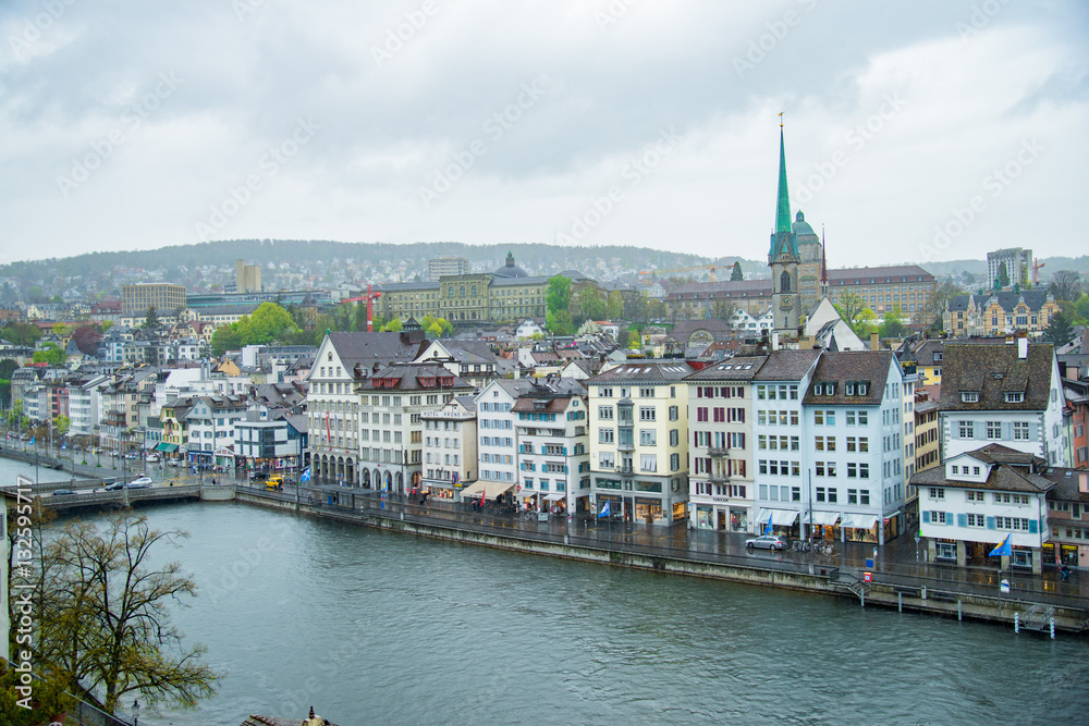 Fototapeta premium View of the historic city center of Zurich downtown with Fraumunster Church and on Limmat river, Zurich, Switzerland - April, 2016