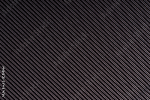Striped dark gray embossed paper. Colored paper. Black texture background