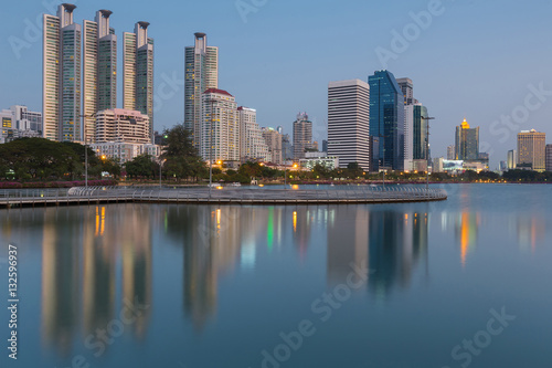 Office building with reflection and clear blue sky background during twilights, Bangkok Thailand