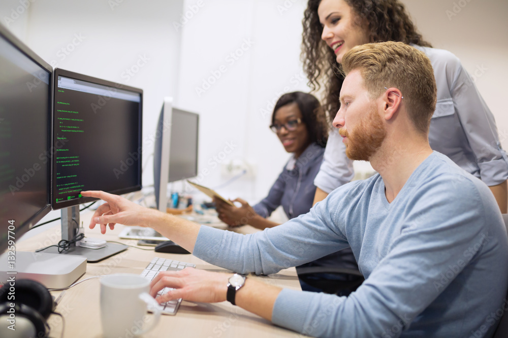 Obraz premium Programmer working in a software developing company
