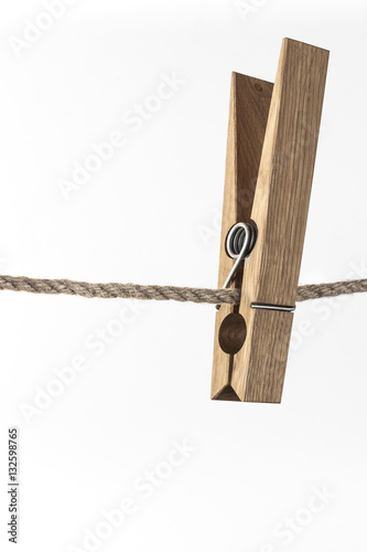 Wooden clothespin on rope