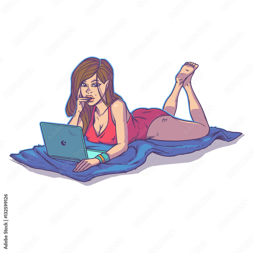 Young girl using laptop while lying on the floor