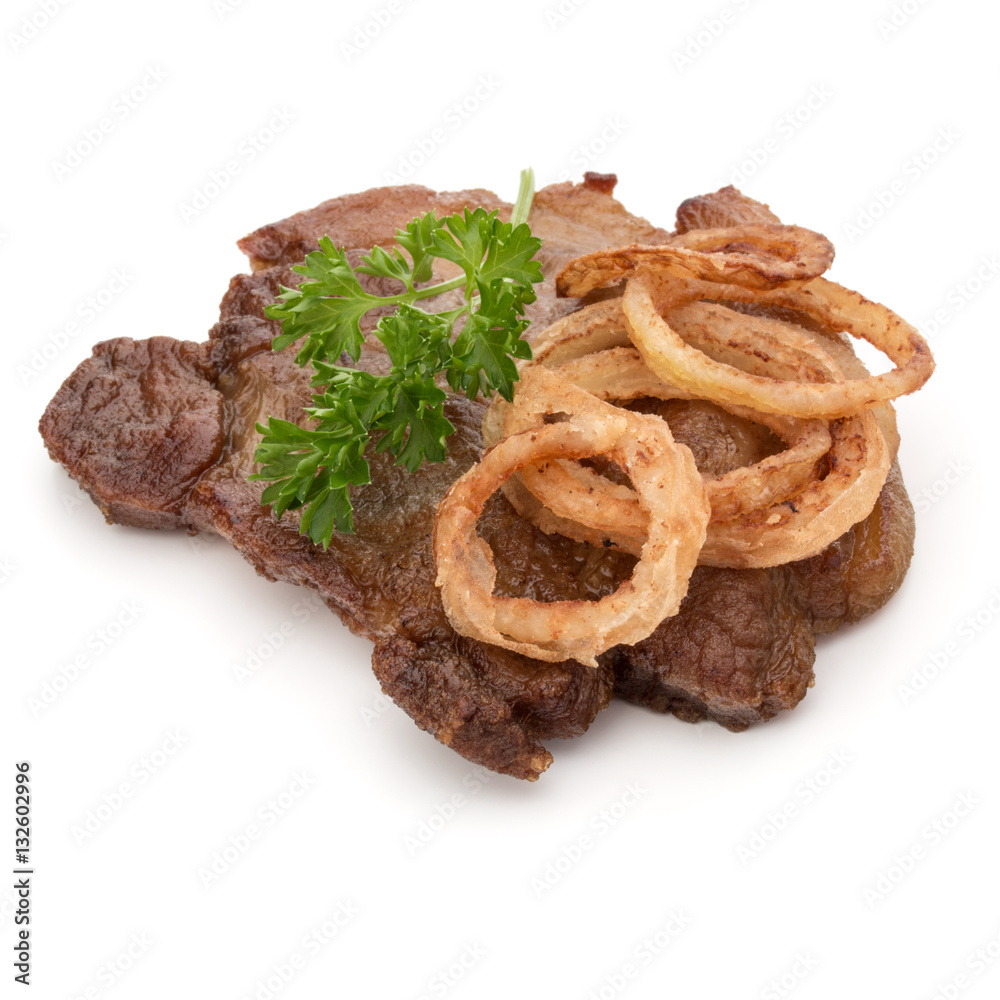 Cooked fried pork meat with parsley herb leaves and onion slices Cooked fried pork meat with parsley herb leaves and onion slices