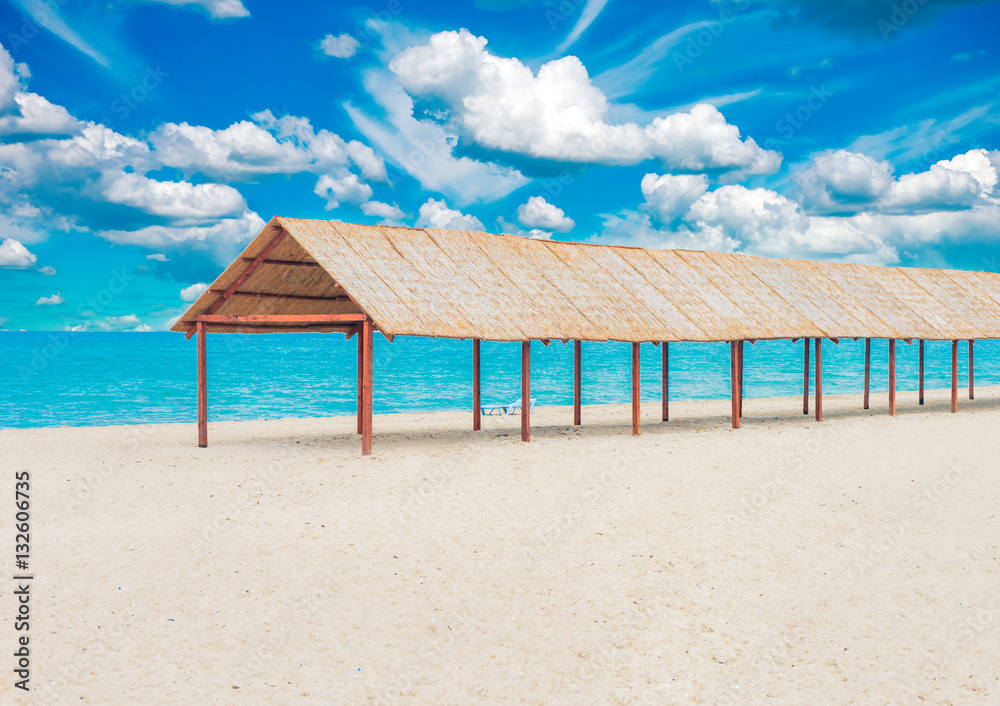Beautiful tropical sandy beach with sun canopy