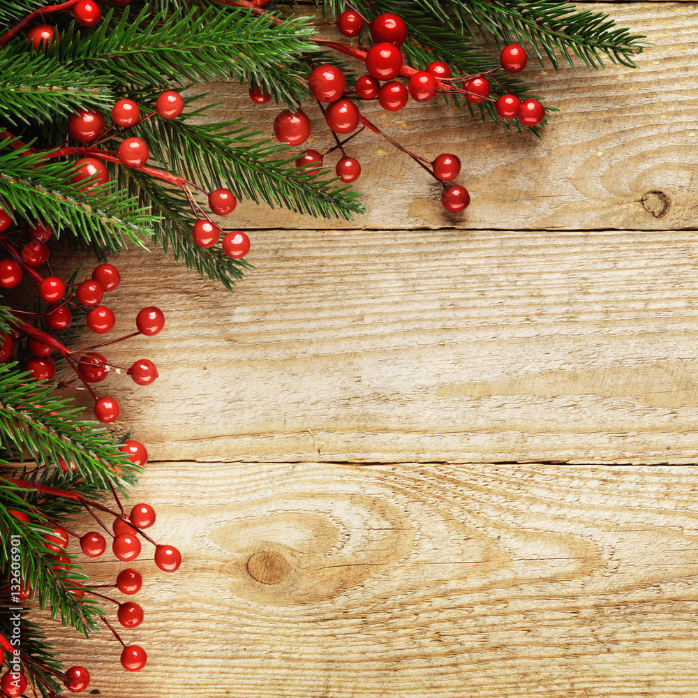 Christmas fir tree with decoration on a wooden board