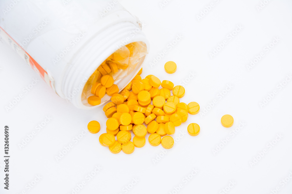 pills with medicine pill bottle close-up on a white background pills with medicine pill bottle close-up on a white background