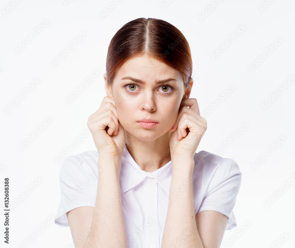 red-haired woman closes his ears red-haired woman closes his ears