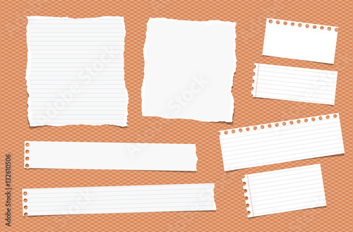 Pieces of ripped different size white note, notebook, copybook paper sheets, strips stuck on squared orange background