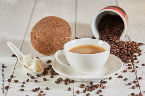 Bulletproof coffee and coconut on table