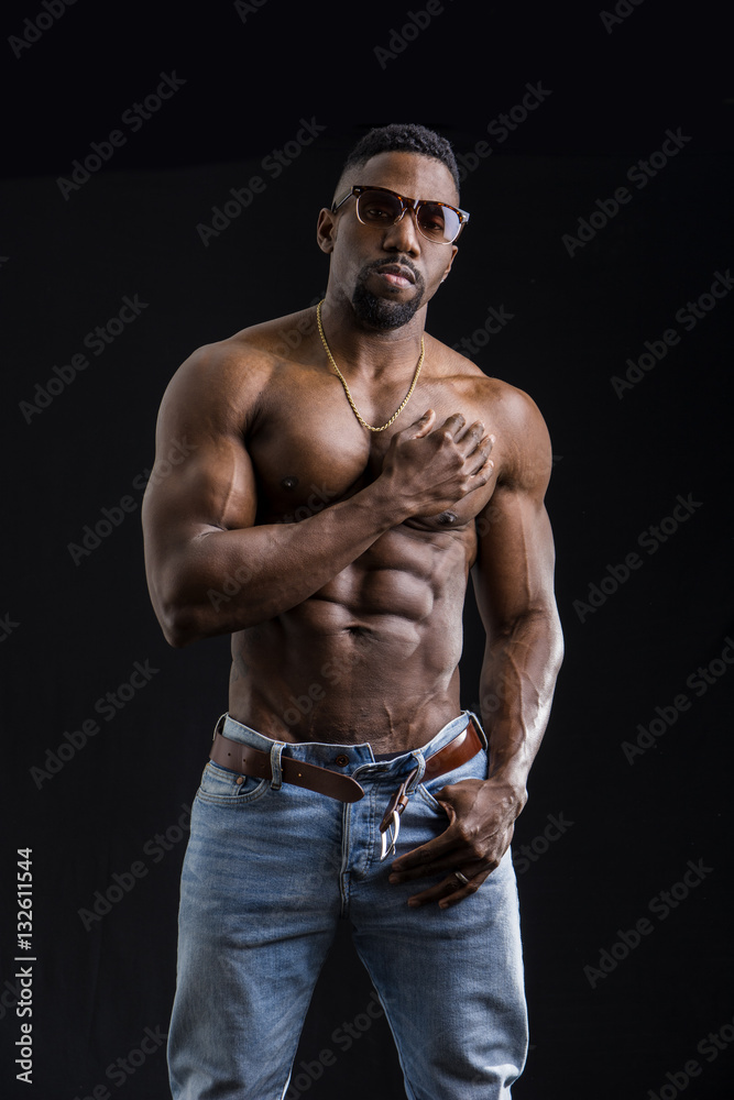 African American bodybuilder man, naked muscular torso, wearing jeans,  isolated on black background Stock Photo | Adobe Stock
