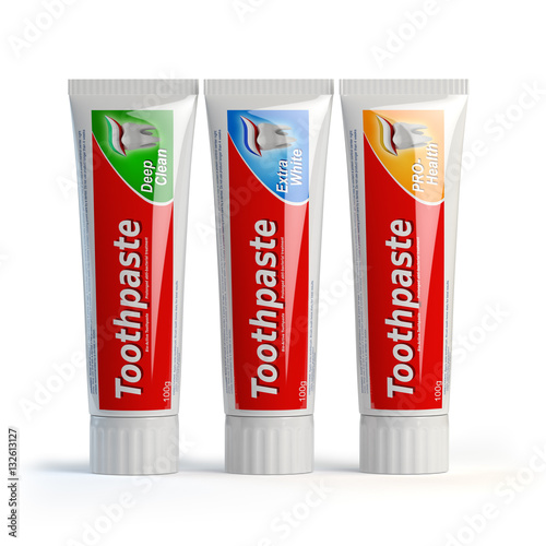 Foto Three toothpaste containers on white isolated background.