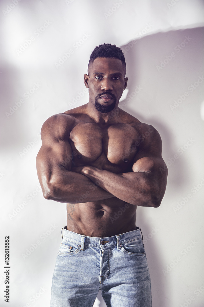 African American bodybuilder man, naked muscular torso, wearing jeans, on  white background Stock Photo | Adobe Stock