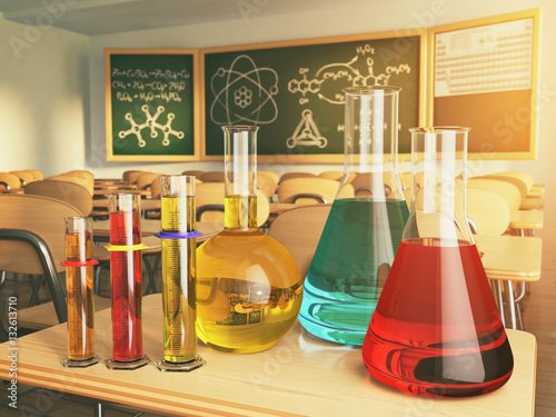 Laboratory glassware with formula on blackdesk in the school che photo