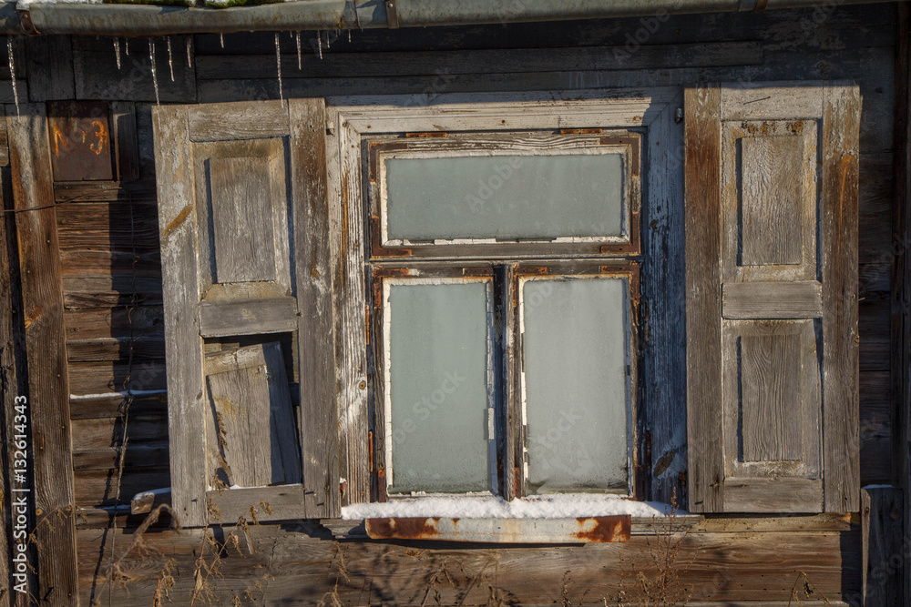 Window of an old ruined wooden house