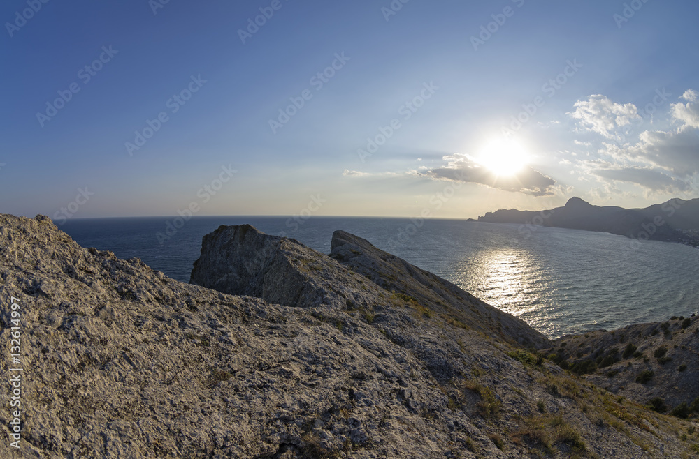 The low late afternoon sun over the coastal mountains. Crimea, S The low late afternoon sun over the coastal mountains. Crimea, S