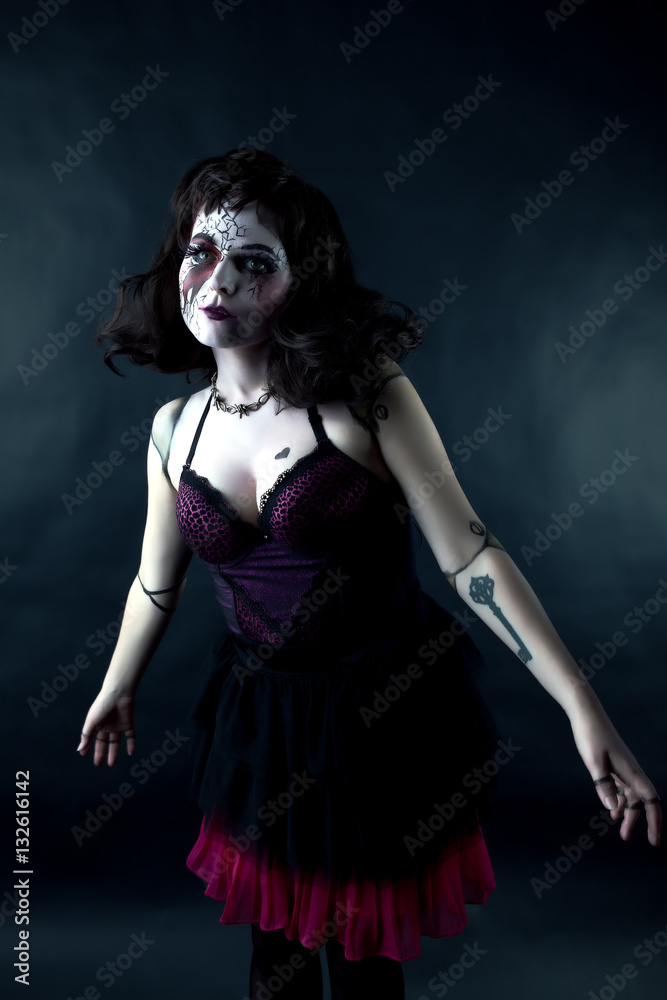 model with makeup scary doll in studio model with makeup scary doll in studio