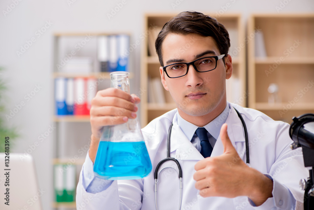 Man doctor working in the lab Man doctor working in the lab