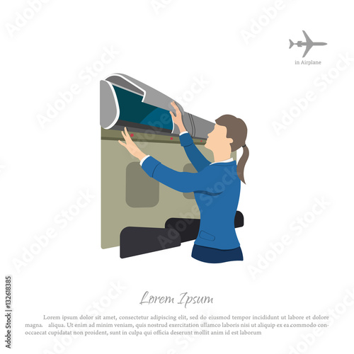 Stewardess opens a box for luggage on the airplane. Woman in uni