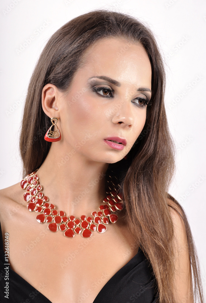 young girl in red necklace and red earrings