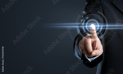 Business man touching virtual interface button