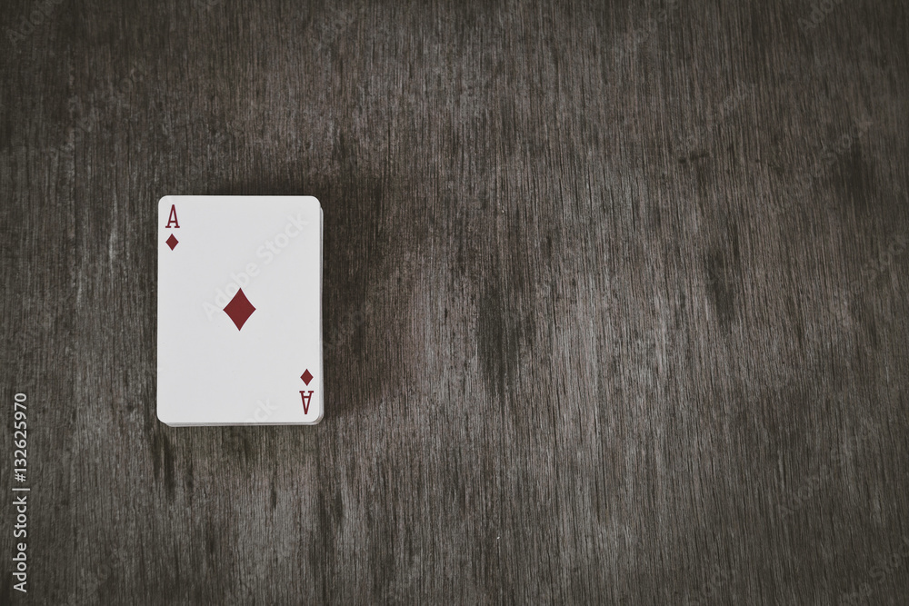 ace of diamonds. playing cards on a wooden background. Risk and Gambling background, abstract.