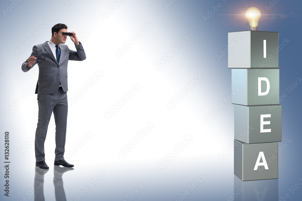 Fototapeta premium Businessman looking for bright ideas