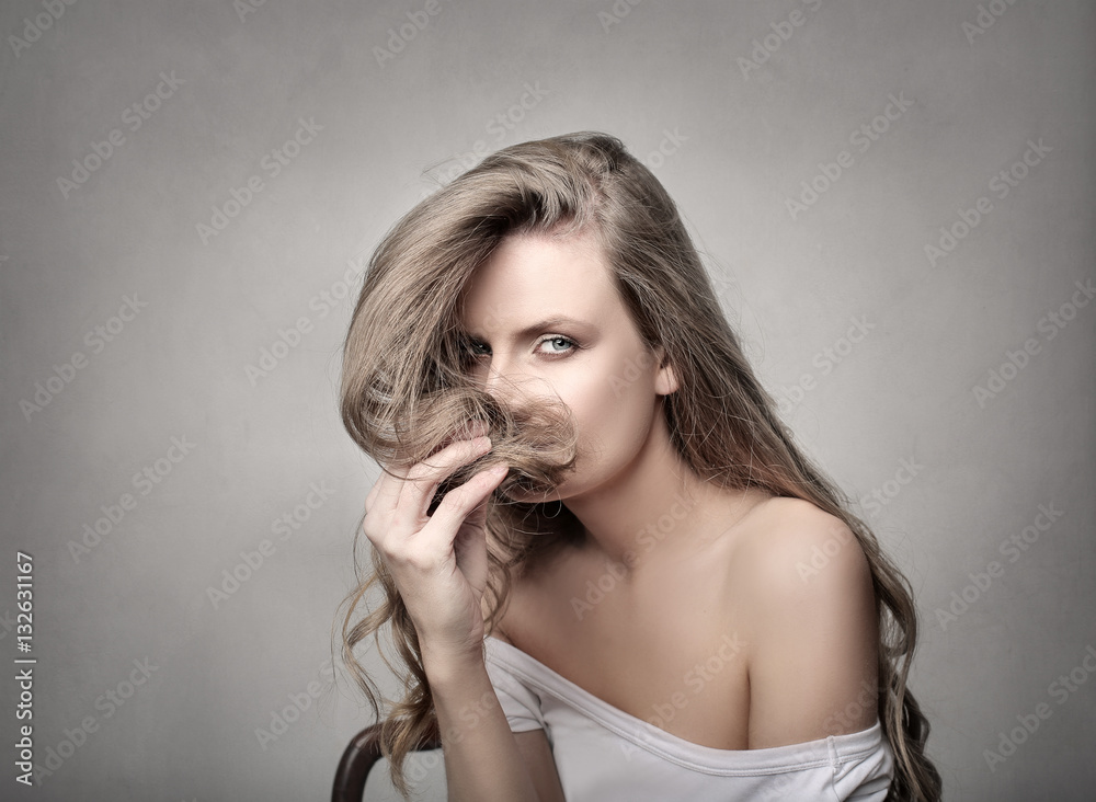 Girl smelling her hair Girl smelling her hair