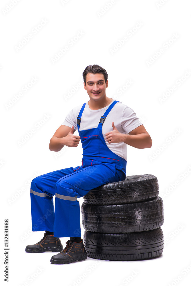 Handsome tyre repairman isolated on white Handsome tyre repairman isolated on white