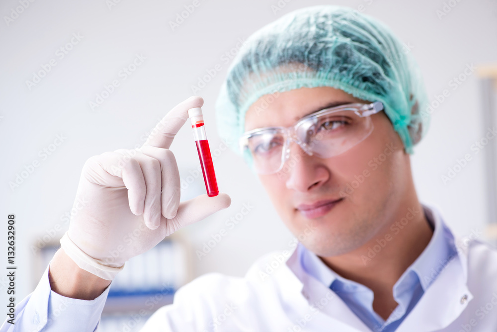 Blood testing in the lab with young scientist