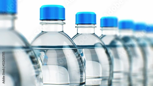 Row of plastic drink water bottles