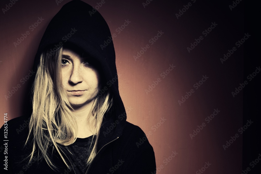 Rebellious teenager in a hoodie.