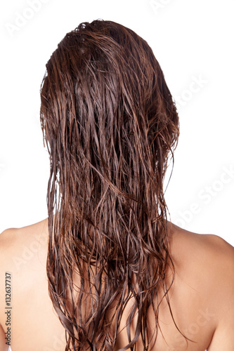 Portrait of a beautiful model with wet hair and clean skin and freckles after shower isolated on white background. 