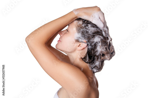 Beautiful woman taking a shower and shampooing her hair. washing hair with Shampoo. studio shot isolated on white background. 