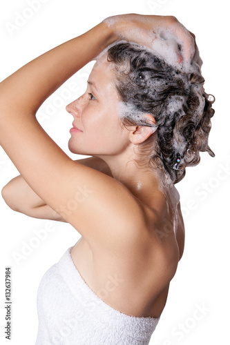 Beautiful woman taking a shower and shampooing her hair. washing hair with Shampoo. studio shot isolated on white background. 