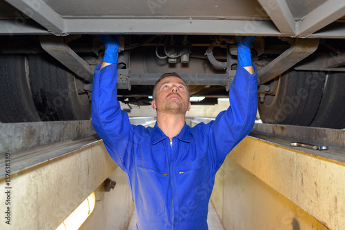 diesel mechanic fixing a vehicle