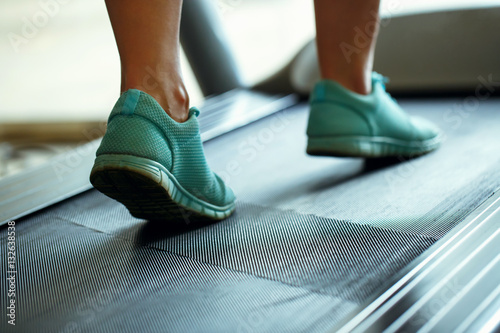 Foot of woman running on treadmill