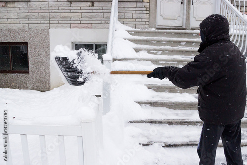Shovelling Snow in a Winter Snow Storm in Montreal Quebec Canada North