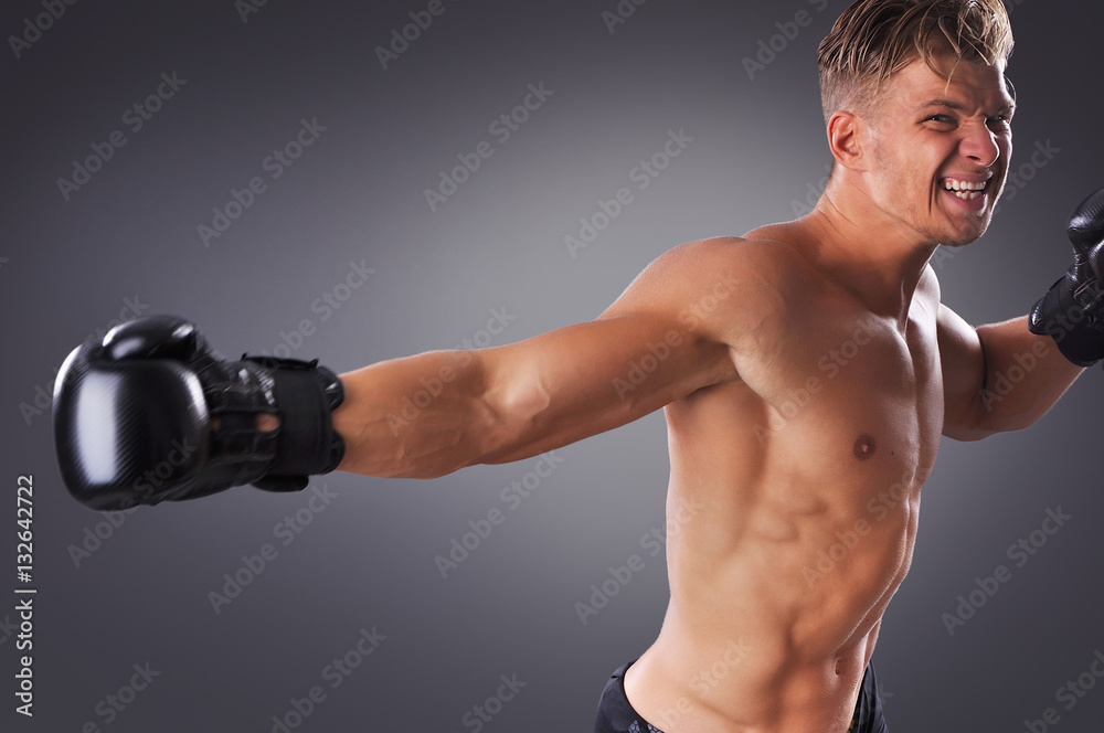 Portrait of Handsome Muscular Fighter Practicing. Concept of Healthy Lifestyle.