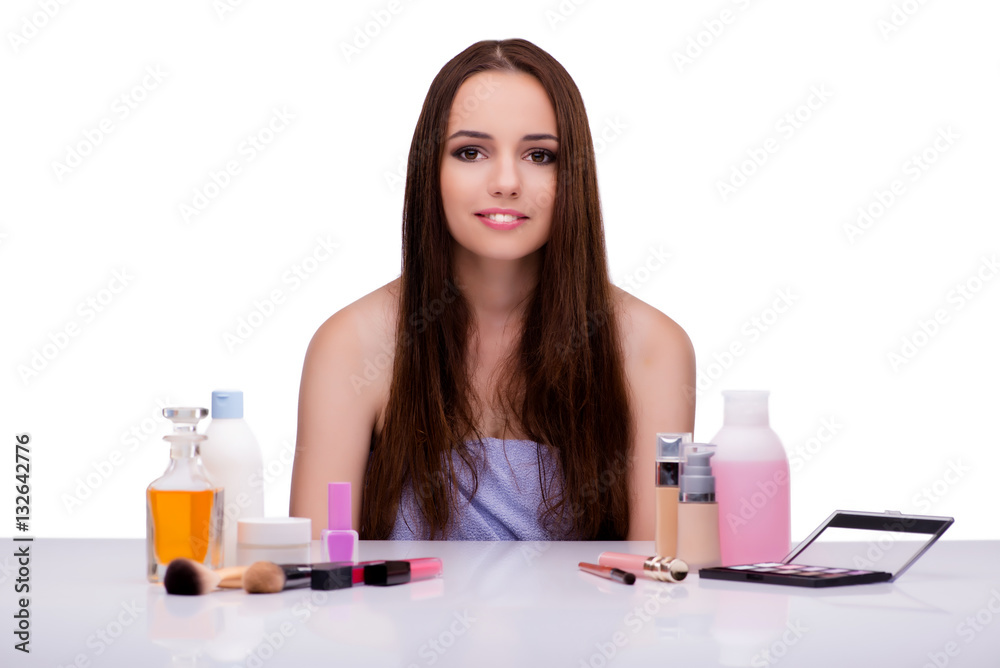 Woman doing makeup isolated on white Woman doing makeup isolated on white