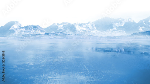 frozen lake with surrounding snow covered rocky mountains photo