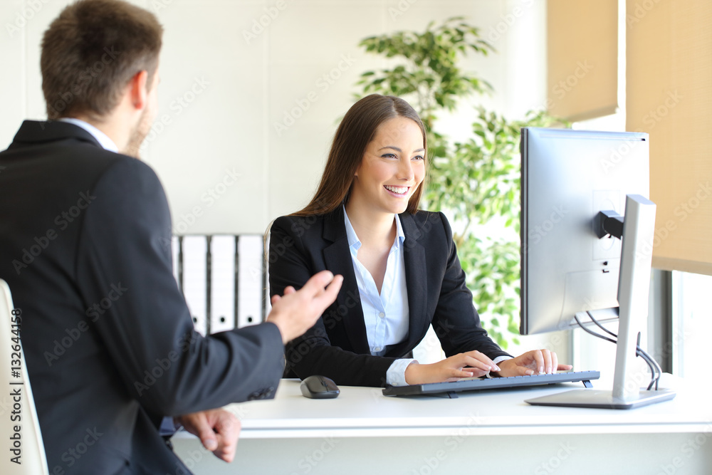 Agent attending a client at office Agent attending a client at office