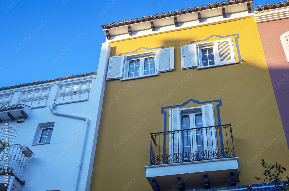 Colorful building facade. Mediterranean residential houses in Little Venice. Port Saplaya,Alboraya, Valencia,Spain.